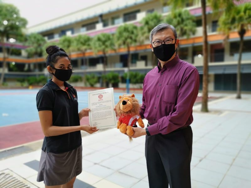 Smita Ishana Rai receiving the ROAR Award of the Month May 2020 from Principal Ong Kim Soon.jpg